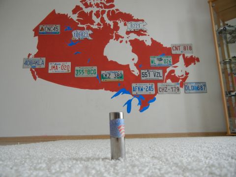 1999 Lincoln Town Car - A collection of license plates are displayed on a wall map of Canada.