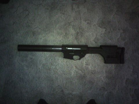2006 Mazda 6 - AR-15 rifle receiver and barrel assembly shown on a carpeted surface.