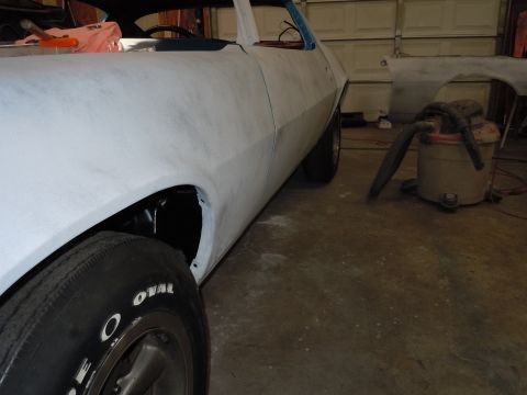 1972 Chevrolet Camaro - A car body in primer is shown from a 3/4 front angle, with tires white lettering.