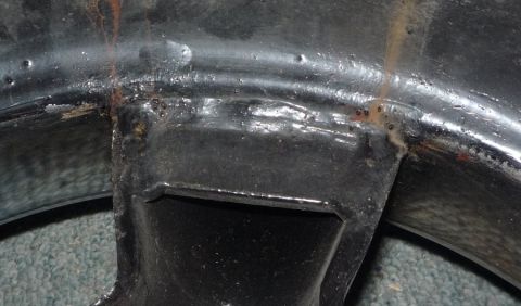 1964 Mercury Monterey - This image shows a close-up of a vehicle's frame with visible rust and welding marks.