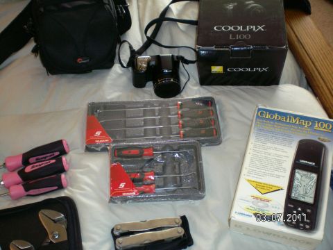 1996 Ford Bronco - Nikon digital 35mm camera w/case, Snap on long/short pick sets, GlobalMap handheld mobile GPS device, multifunction tool.