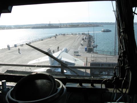 1971 Ford Ranchero - A view from a ship's interior shows an aircraft carrier deck with a jet and other vessels in the distance.