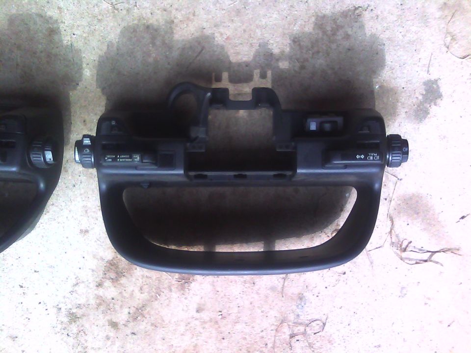 Black dashboard trim with knobs and buttons