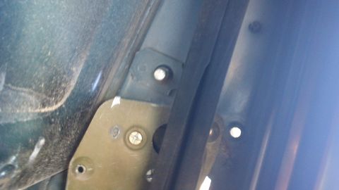 1994 Ford Bronco - Detail of the interior door jamb structure, showing mounting points and a rubber seal.