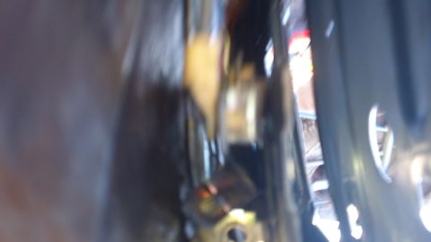 1994 Ford Bronco - A blurry close-up shot of engine bay components, the Supermotors.net watermark at the bottom right.