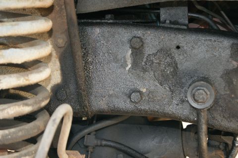 1978 Ford Bronco - Detail of the undercarriage, showing frame and suspension parts.