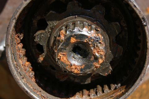 1978 Ford Bronco - This heavily corroded gear assembly shows significant wear and rust, indicating a need for repair or replacement.