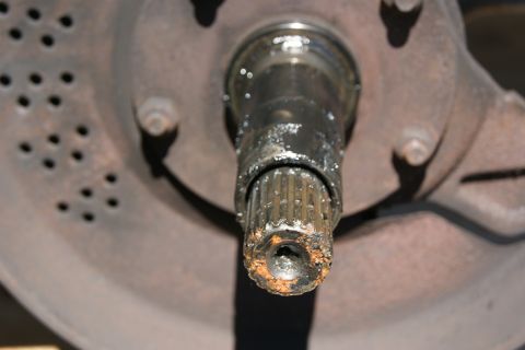1978 Ford Bronco - Close-up of a rusted wheel hub and axle splines, likely needing replacement.