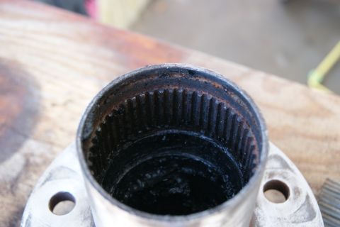 1978 Ford Bronco - A close-up view of a splined hub assembly, showing internal wear and accumulated grease.