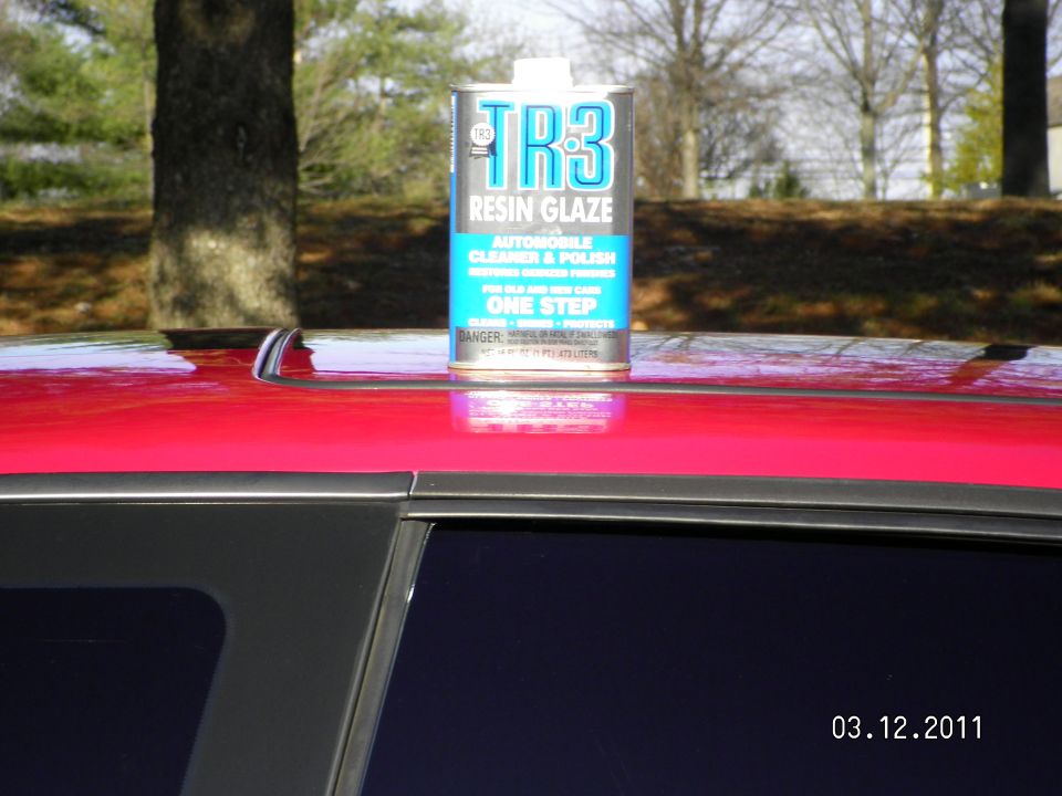 Can of TR3 Resin Glaze on red car roof with dark tinted window