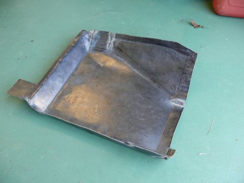 1976 Chevrolet Corvette - This metal part has cut lines and welds visible on its surface.