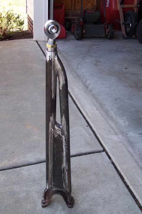 2000 Ford F-150 - A custom-made suspension part is shown in a driveway, with lawn equipment in the background.