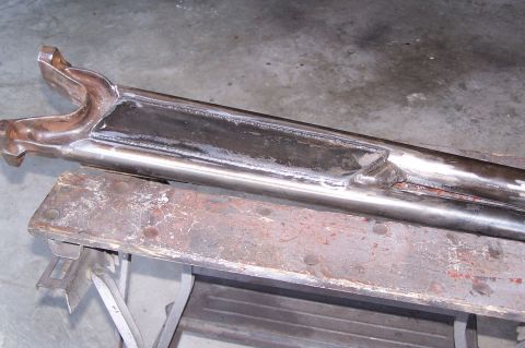 2000 Ford F-150 - Close-up of a custom-fabricated metal suspension component with extensive welding.