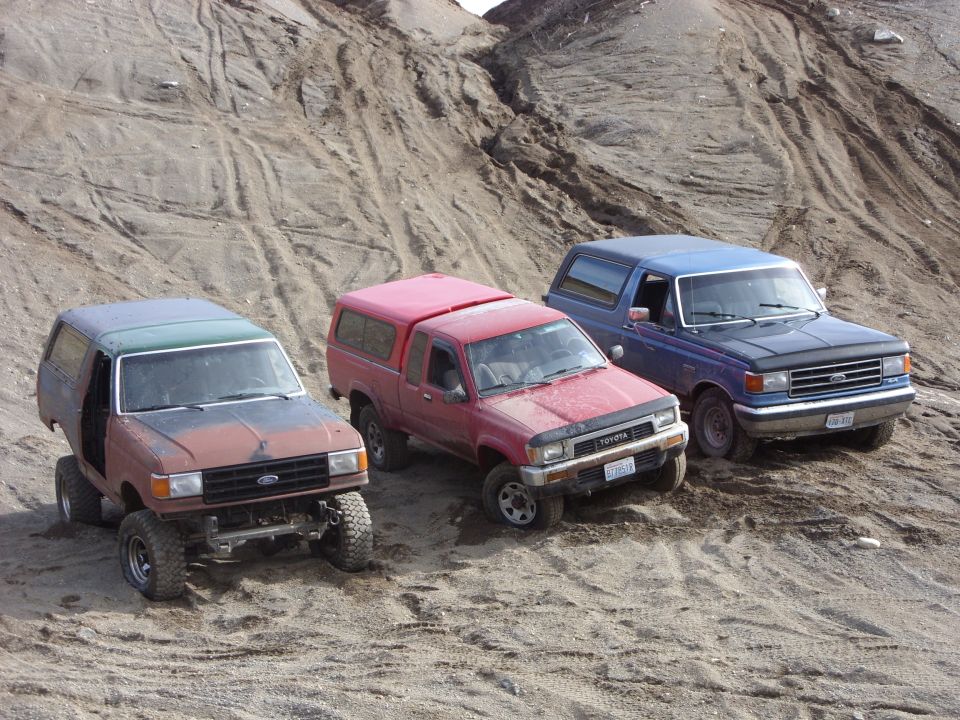 Blue 1988 Ford Bronco front grille and headlights visible