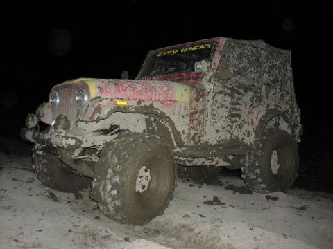 1981 Ford Bronco - This heavily mud-splattered Jeep CJ-7 is equipped for off-road adventures.