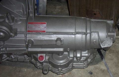 1997 Ford Taurus - Close-up of an automatic transmission, showing a manufacturer's label with some text.