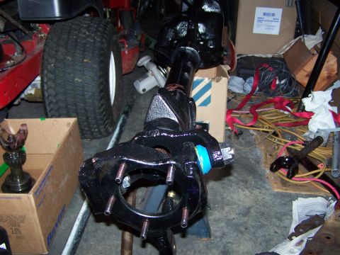 1992 Ford Bronco - Close-up of a front axle assembly, possibly for a Ford Bronco, with a blue suspension component visible.