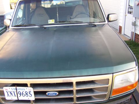 1992 Ford Bronco - The front grille and headlights of a 1992 Ford Bronco are visible, along with a Virginia license plate.