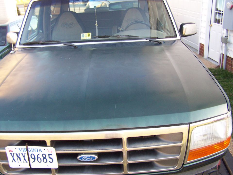 Front view of a green 1992 Ford Bronco with a Virginia license plate