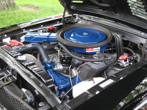 1968 Shelby GT500 - The engine bay of a 1968 Shelby GT500, blue Cobra Le Mans valve covers and an Autolite air cleaner assembly.