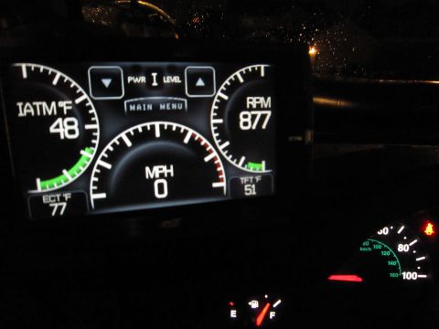 2008 Jeep Wrangler - The digital dashboard displays various readings including air intake temperature, speed, engine RPM, and TFT temperature.