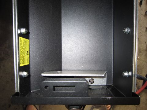 2008 Jeep Wrangler - A close-up view of an interior compartment, showing a warning label and various fixtures.