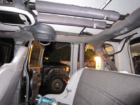 2008 Jeep Wrangler - View from inside a Jeep, looking out at another vehicle parked in the driveway.