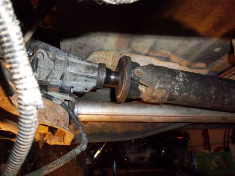 1989 Ford F-150 - Underside view of a vehicle's driveshaft and transmission components.