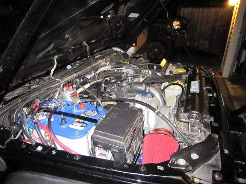 2008 Jeep Wrangler - Engine bay of a 2008 Jeep Wrangler, modified with dual batteries and an aftermarket air intake.