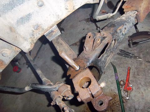 1989 Ford F-150 - This image shows a close-up of vehicle suspension components, likely from a truck, with various tools scattered around.