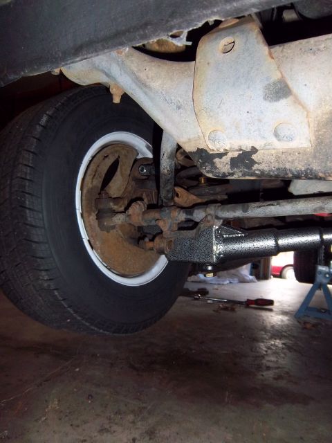 1989 Ford F-150 - Close-up of the front suspension and tire assembly on a 1989 Ford F-150.