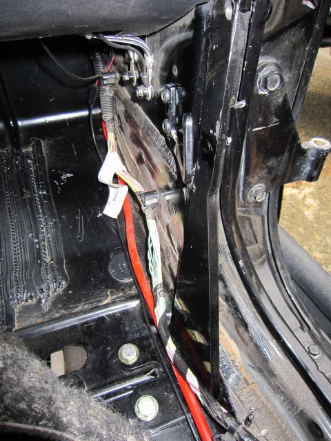 2008 Jeep Wrangler - Close-up view of the interior wiring harness, showing various colored cables and connectors.