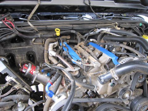 2008 Jeep Wrangler - Close-up view of a vehicle's engine bay, showing various mechanical parts and wiring.