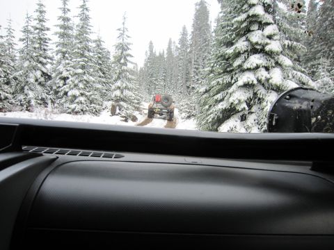 2008 Jeep Wrangler - Two Jeep Wranglers navigate a snowy forest road, one following the other.