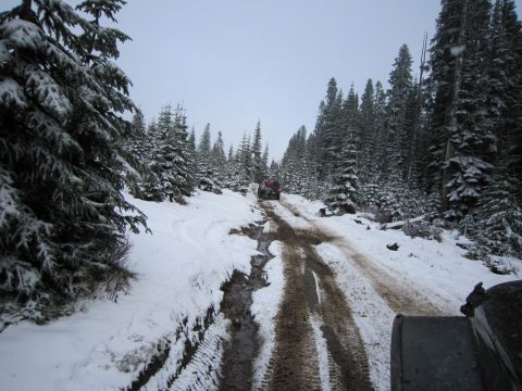 2008 Jeep Wrangler - Navigating a challenging winter trail with multiple vehicles requires careful driving.