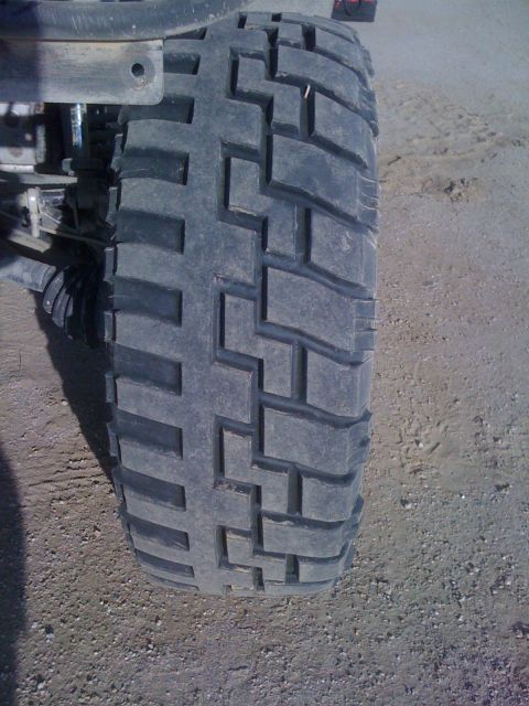 1968 Ford Mustang - A close-up view of a tire with aggressive tread, suitable for off-road use.