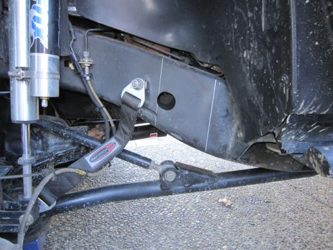 2008 Jeep Wrangler - Detail shot of the suspension and frame components of a modified off-road vehicle.