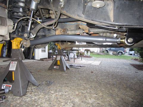 2008 Jeep Wrangler - Close-up of the suspension system of a lifted Jeep Wrangler, showing the front long arm components.