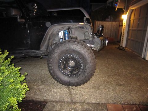 2008 Jeep Wrangler - Front view of a modified Jeep Wrangler showing off-road tire and suspension components.