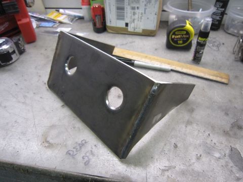 2008 Jeep Wrangler - Custom metal bracket with two holes, likely for automotive or fabrication use.