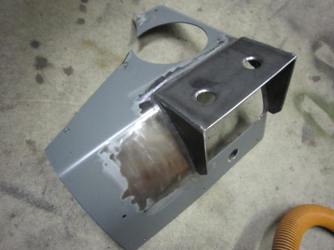 2008 Jeep Wrangler - Fabricated metal bracket and panel assembly on a concrete floor.