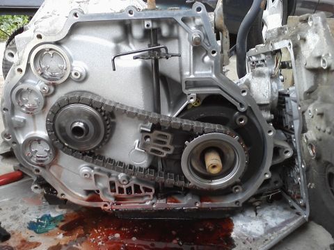 1993 Ford Taurus - The internal components of an automatic transmission are exposed, showing the chain and gears.
