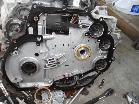 1993 Ford Taurus - The transmission valve body is disassembled, revealing its intricate internal workings and the gasket's mounting points.