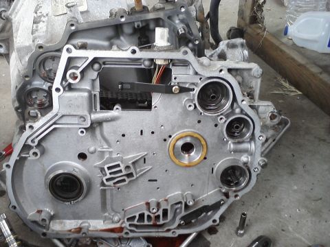 1993 Ford Taurus - Close-up of a disassembled transmission part, showing internal gears and seals.