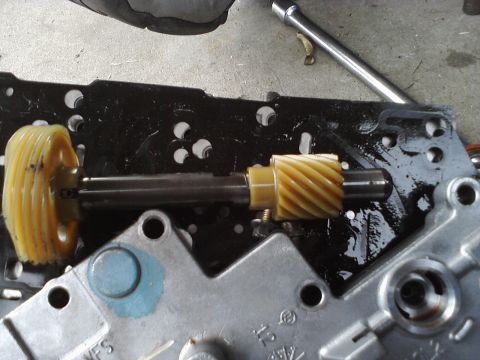 1993 Ford Taurus - Close-up of a transmission gear and shaft, likely from a vehicle's internal mechanics.