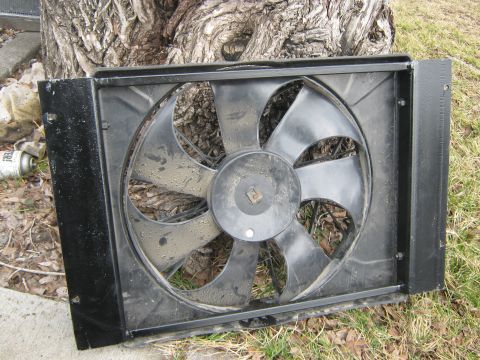 1972 Ford F-250 - Radiator fan assembly shown outdoors, resting on grass near a tree.