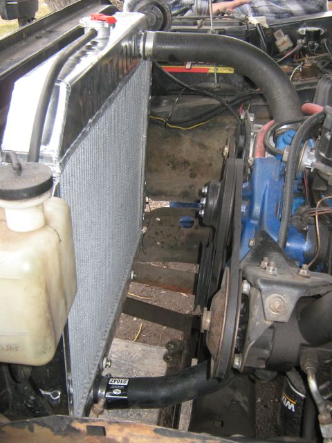 1972 Ford F-250 - Close-up view of engine bay components, including the radiator, fan, and belts.
