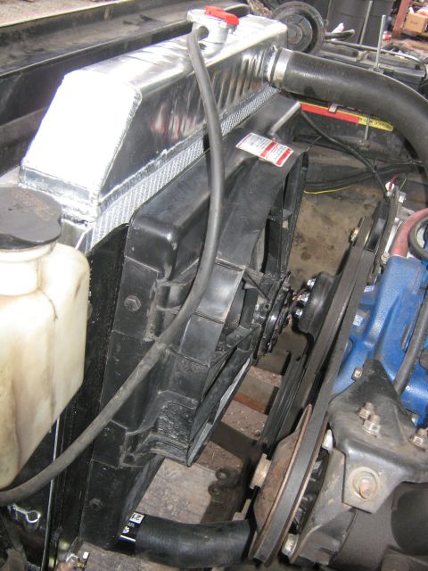 1972 Ford F-250 - Close-up view of the radiator and fan system within an engine bay.