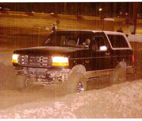 1995 Ford Bronco - This 1995 Ford Bronco navigates through a muddy terrain.