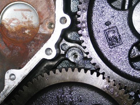 1984 Ford Bronco - Gears within an engine block show signs of wear and rust, with a "25" marking visible on one component.